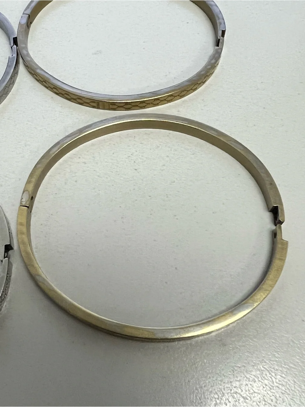Chanel, LV, Gucci Stackable Silver and Gold Logo Bangle Set - Picture 15 of 16